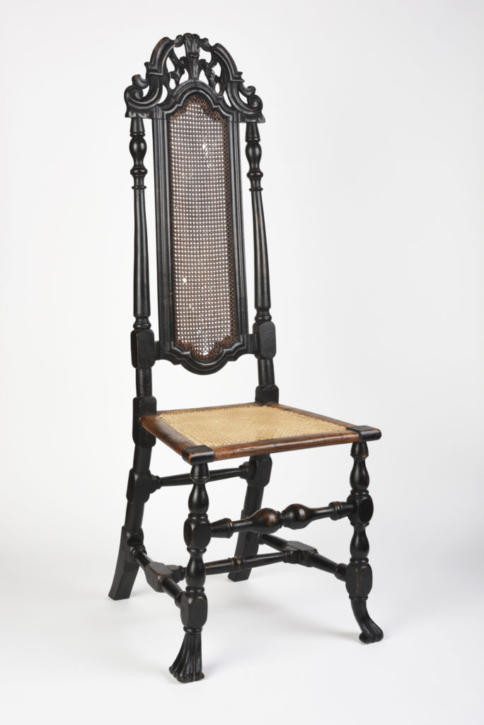 Eighteenth century woven seat chair made of dark wood.